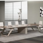 Conference room scene with a long table and chairs